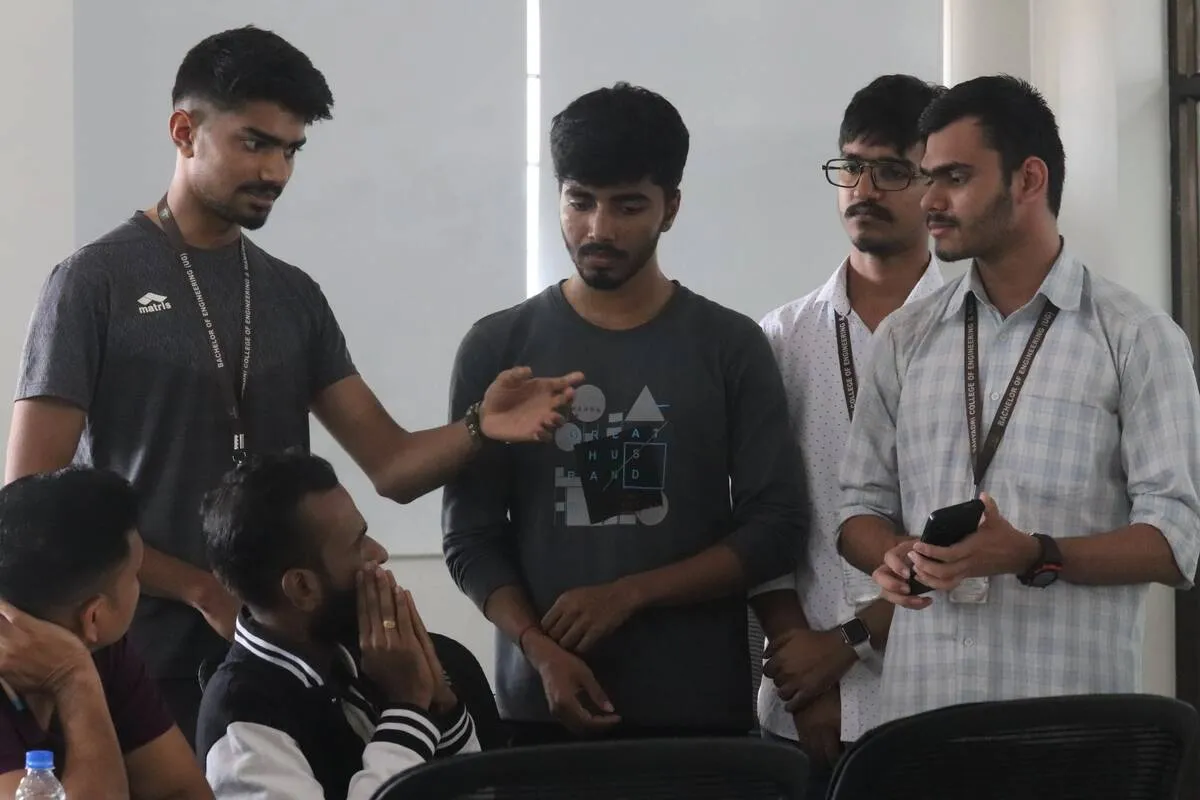 Mentors discussing with a team